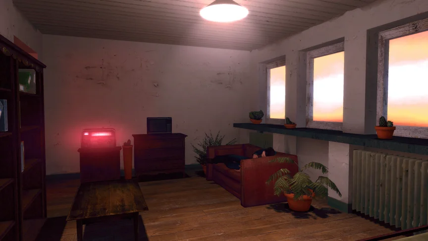 A warm cluttered apartment with a girl laying on a couch.