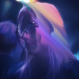 Photo of Theia, washed in blue purple light, with her hair flickering in vibrant hues.